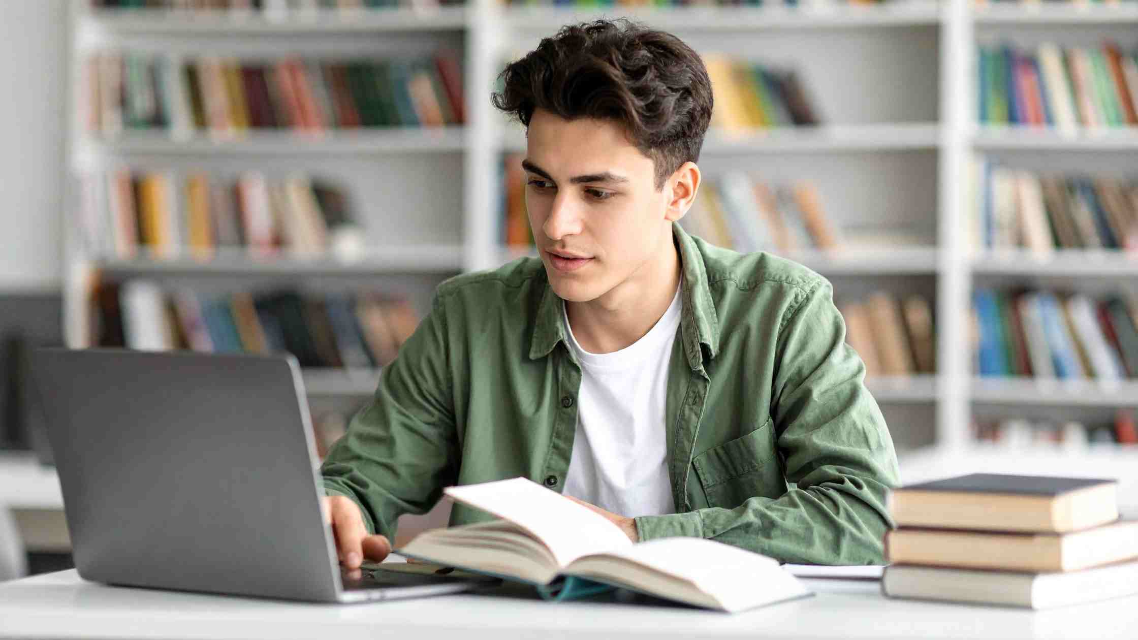 Student studying in a library, representing focused preparation to improve chances of getting admission into Duke University.