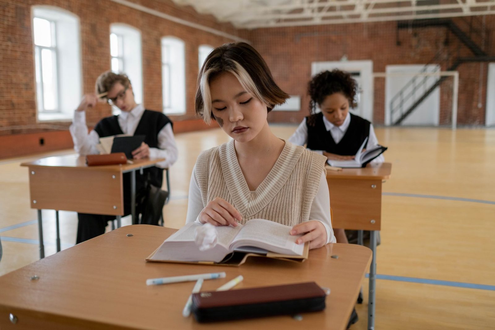 Student preparing college application materials at a desk